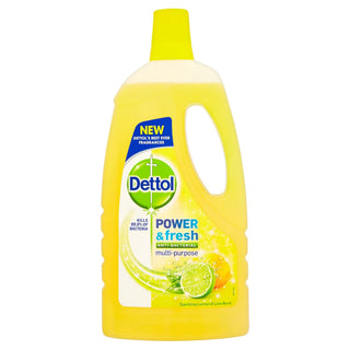 A bottle of Dettol Power Multi-Surface Cleaner with a lemon and lime scent. The label is predominantly yellow with images of lemons and lime, and text detailing the product's uses and features.